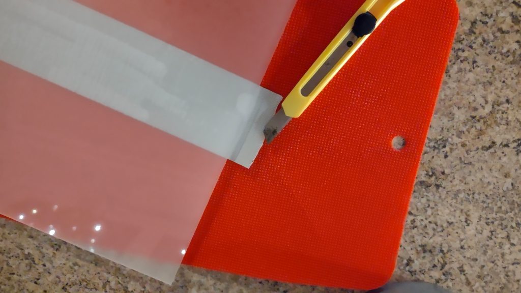 Cutting off the excess tape