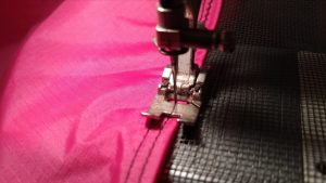 Sewing the mesh to the sail