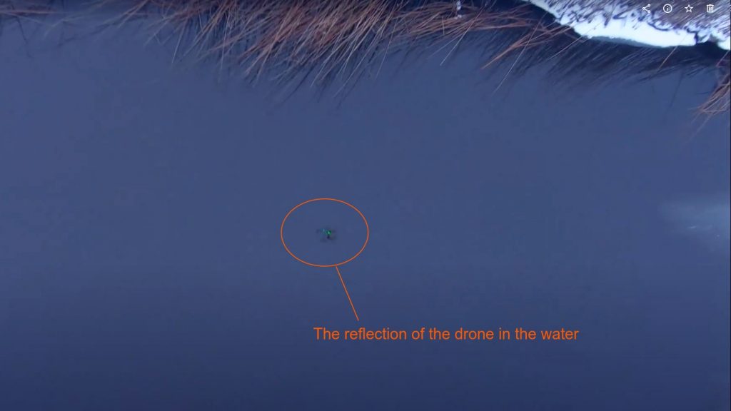 The drone reflected in the water