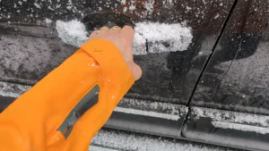 Opening the car dor in snowy weather